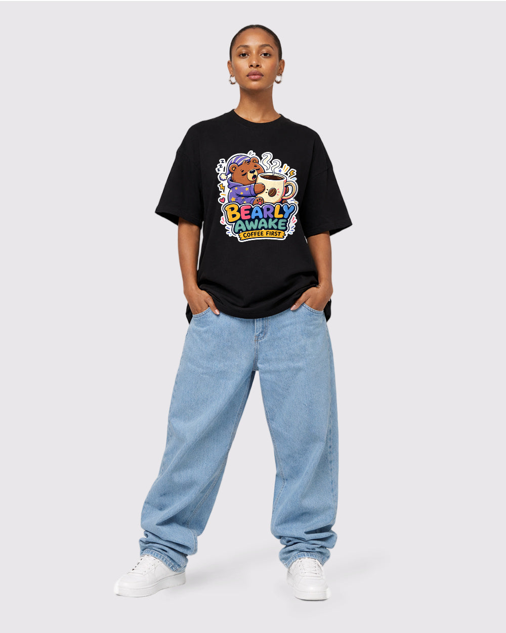 Beige T-shirt full-body fit view featuring Bearly Awake coffee bear artwork