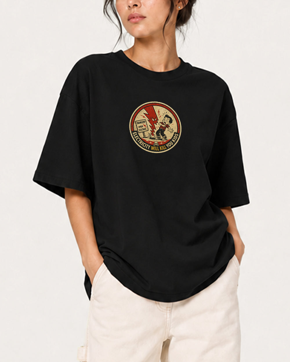 Danger High Voltage Pop Culture Graphic T-Shirt in Black, front model view 1