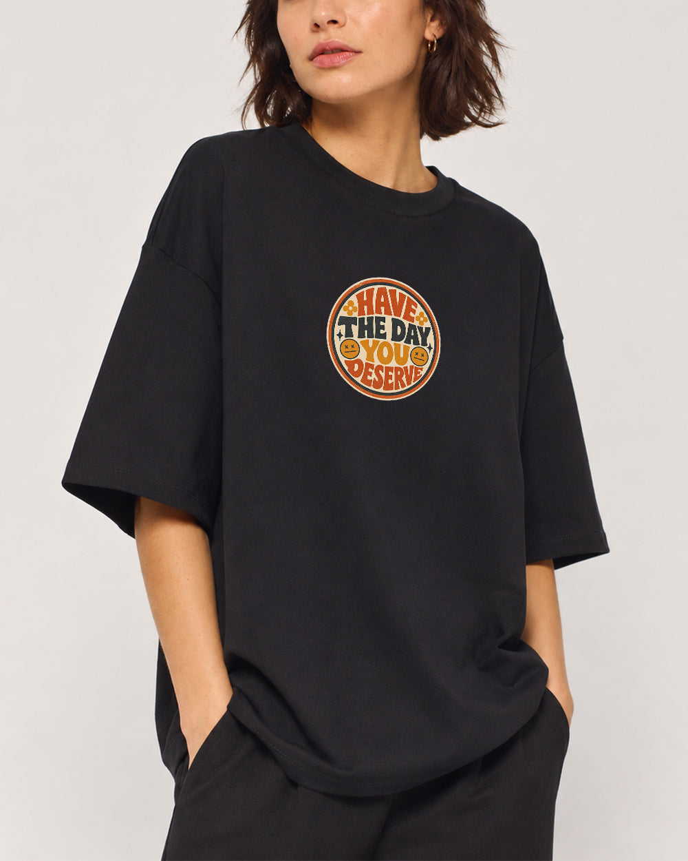 Have The Day You Deserve Pop Culture Graphic T-Shirt in Black, front model view 1