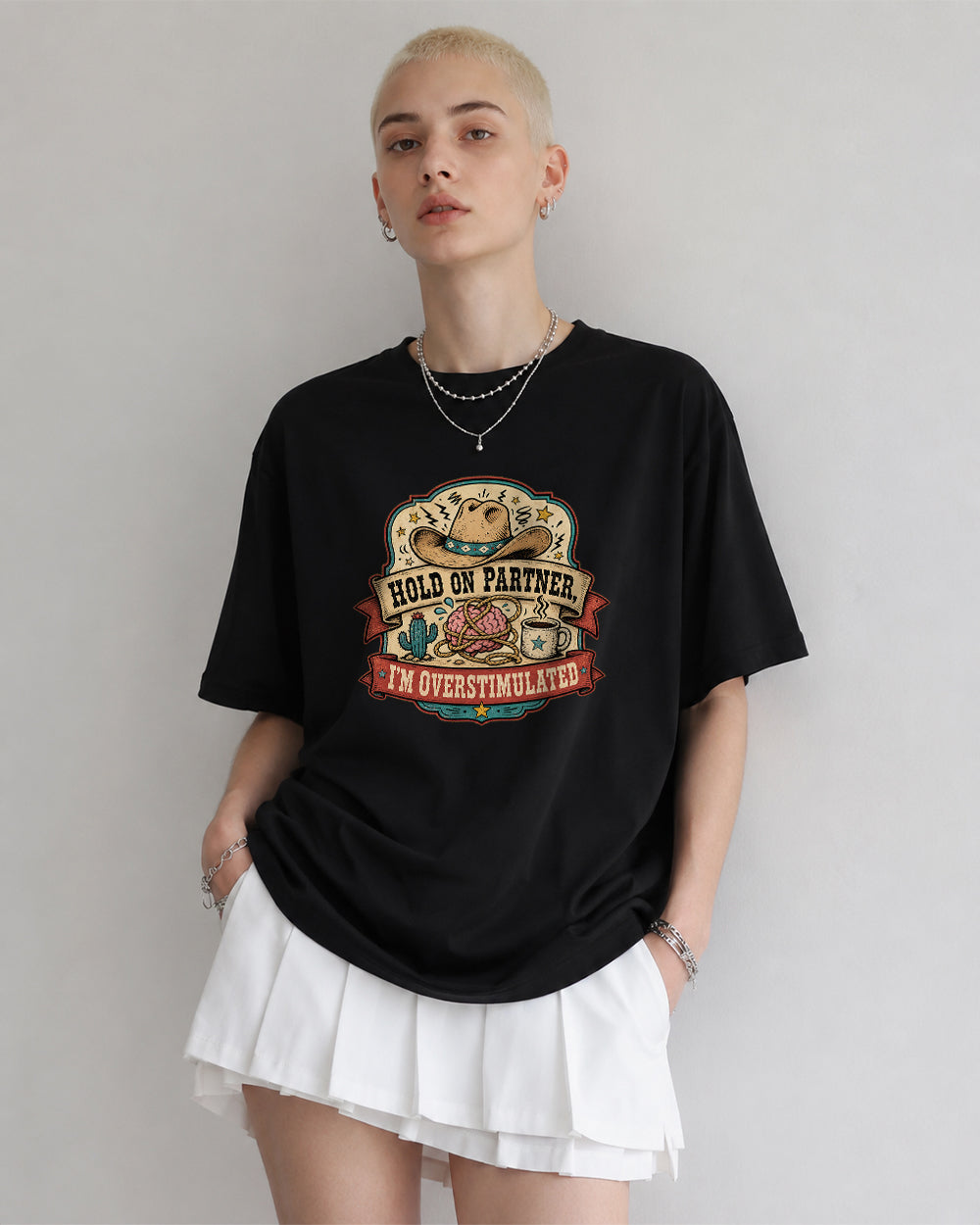 Hold On Partner, I'm Overstimulated Funny Graphic T-Shirt in Black, front model view 1