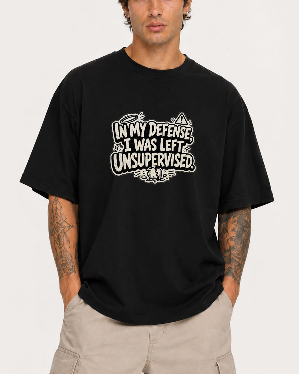 In My Defense, I Was Left Unsupervised Pop Culture Graphic T-Shirt in Black, front model view 1