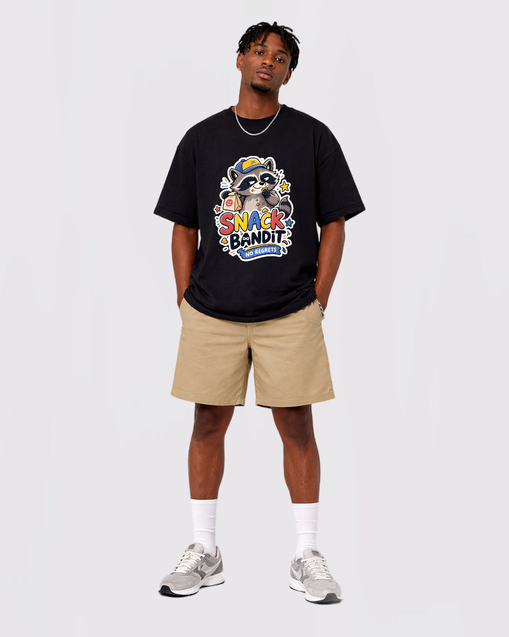 Beige T-shirt full-body fit view featuring Snack Bandit raccoon artwork