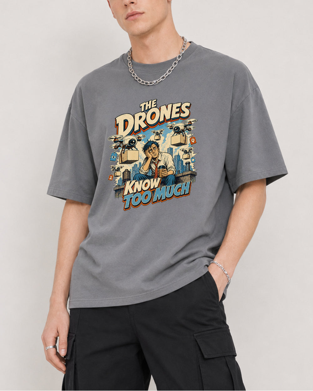 The Drones Know Too Much Funny Graphic T-Shirt in Gray, front model view 4